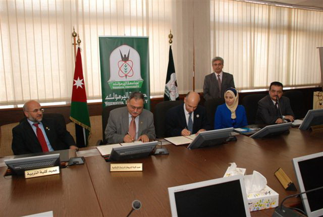 A Cooperation Agreement Signed between IUG and Yarmouk University